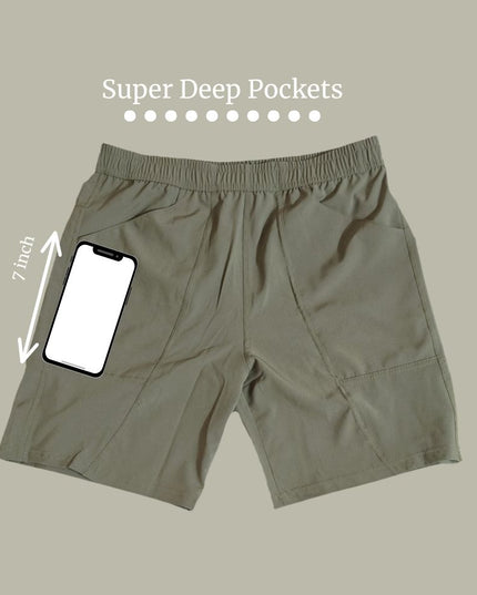 Trekmonk shorts with super deep pockets and a smartphone for size reference on a beige background