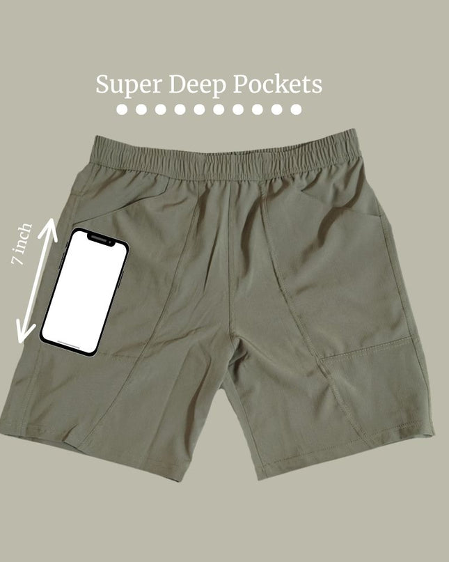 Trekmonk shorts with super deep pockets and a smartphone for size reference on a beige background