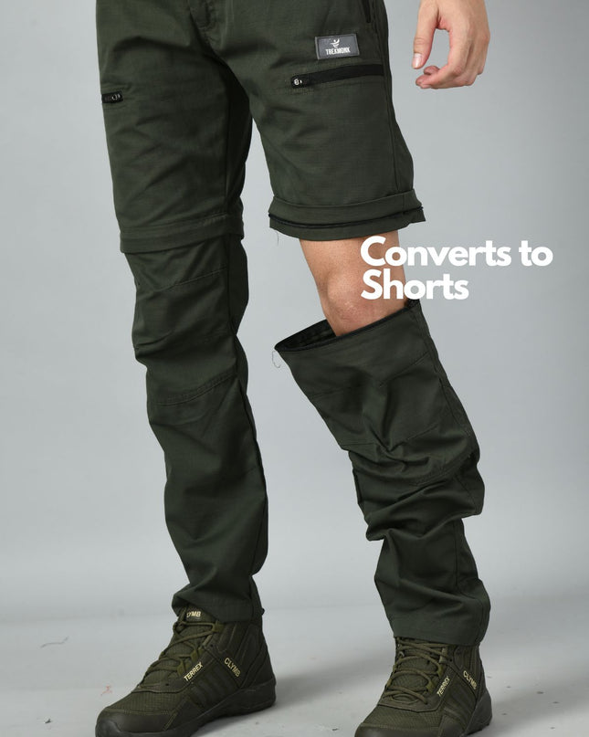 Olive green Convertible trek pants with a feature that converts to multi purpose shorts on a gray background